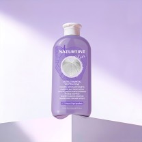 Champú matizador violeta sobre peana